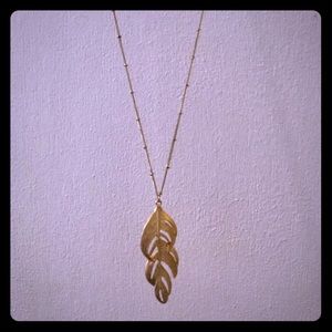 Long gold feather necklace